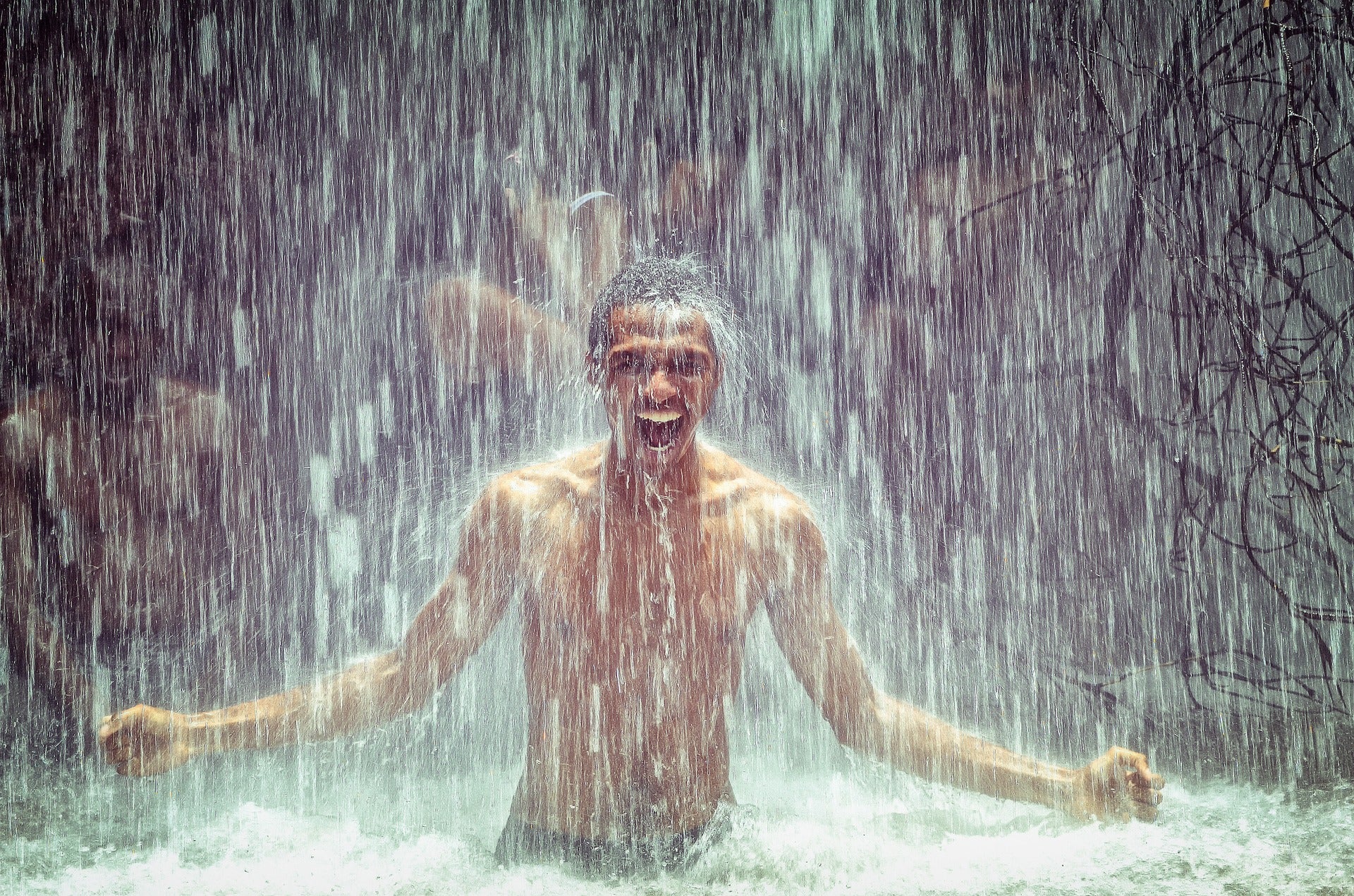 Man in waterfall